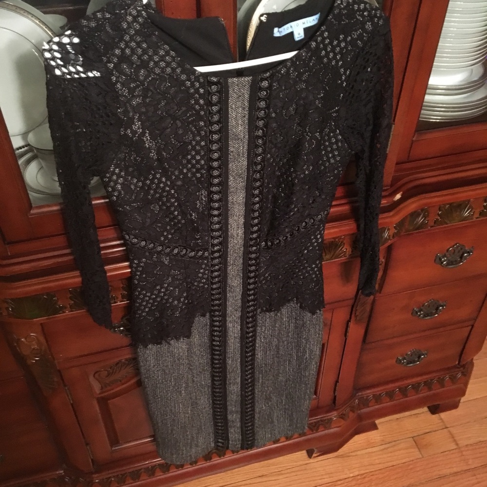 Fitted black dress with lace sleeves